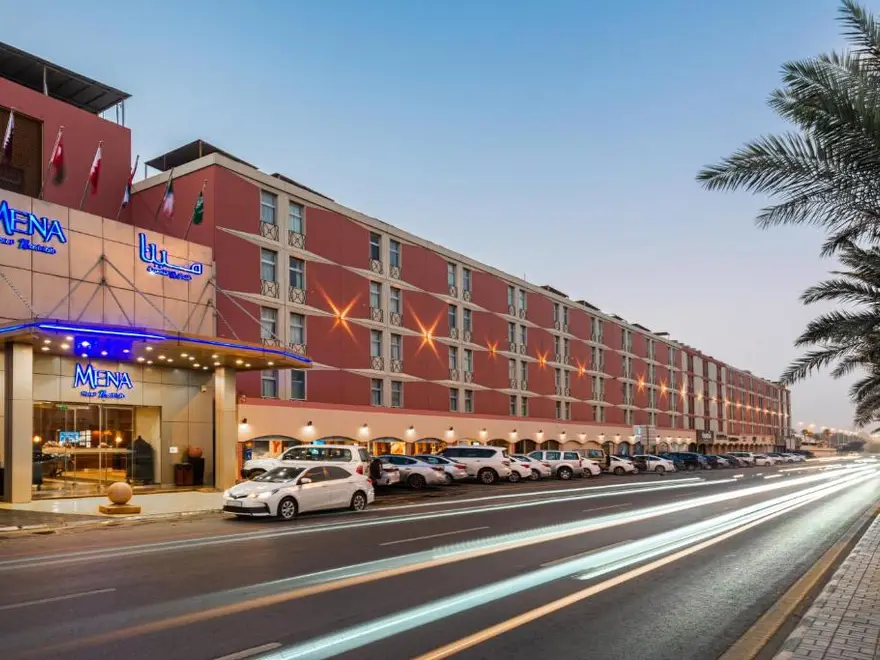 Street view of MENA Hotel Nasiriyah in Riyadh at twilight